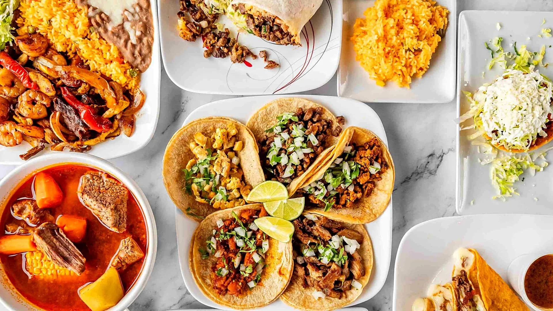 Tacos, caldo de res, burrito, fajitas and rice from Super Tacos in Dacula